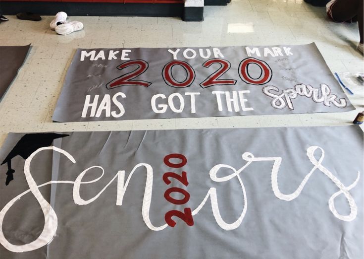 two signs that say seniors make your mark and 2020 has got the spirit