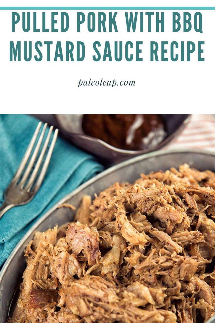 pulled pork with bbq mustard sauce recipe in a serving dish on a blue cloth