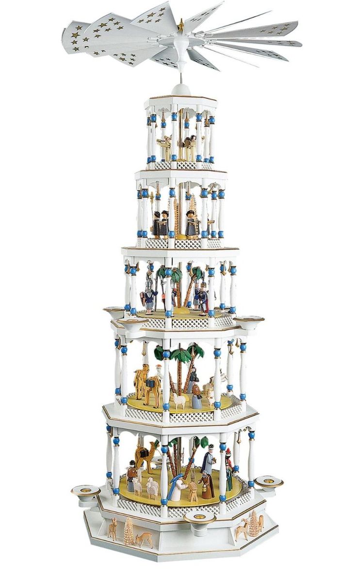 a tall white tower with lots of different items on it's top and bottom