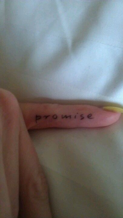 someone has written the word prom on their arm and is laying in bed with white sheets