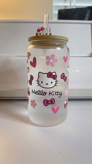 a glass jar with hello kitty on it