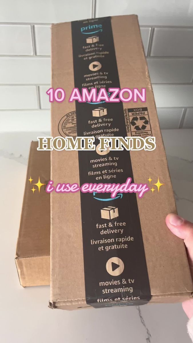 someone is holding up a cardboard box with the words 10 amazon home finds on it