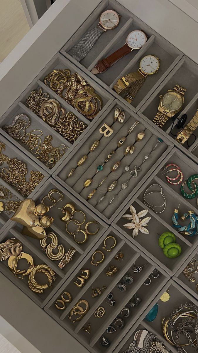 a drawer filled with lots of different types of jewelry