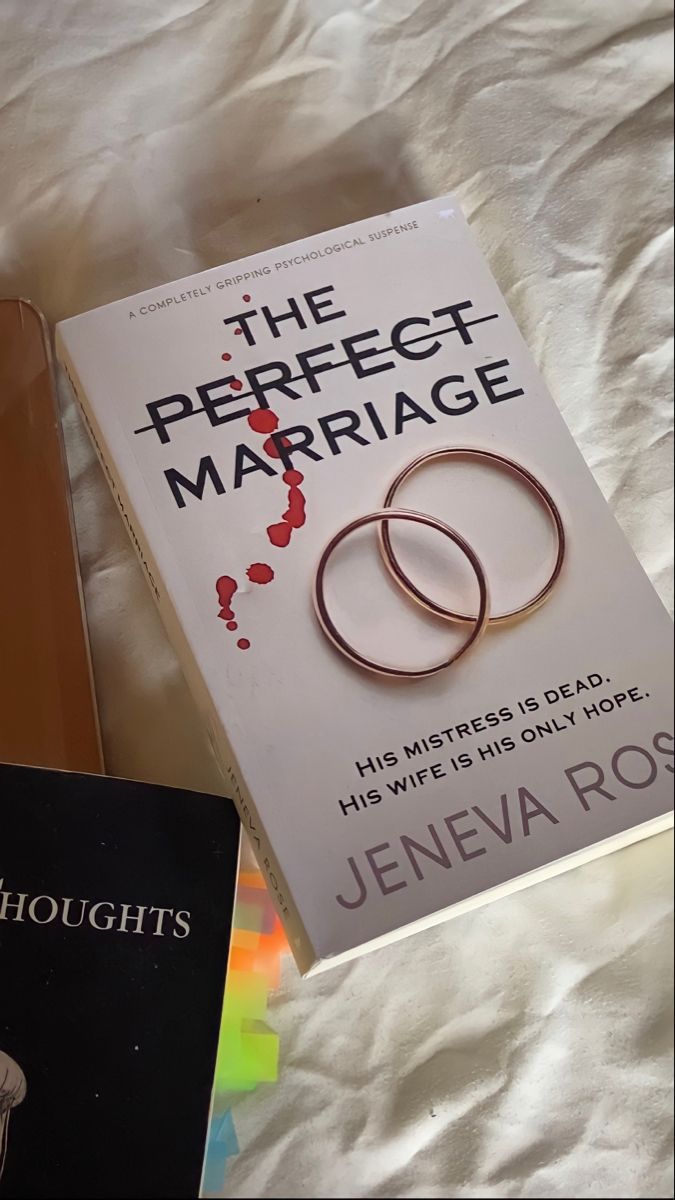 there are two books on the bed next to each other, one is for marriage and the other is for marriage