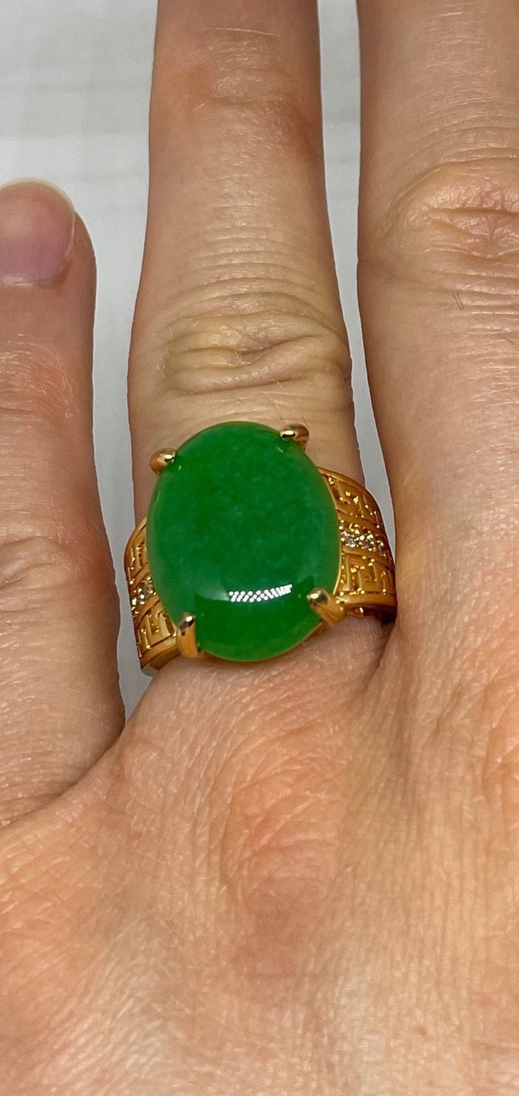 "Vintage Lucky Green Nephrite Jade ring Large green nephrite jade  Ornate gold finished White bronze Vintage ring, does not tarnish, NOT sterling Size 6.5,or  7 ONLY  My jeweler can custom re size for a $20 fee  All rings are shipped free in the US in a nice gift box.   Check out our over a THOUSAND great reviews Engraving is $4 per letter and is not always perfect depending on the piece. It can take a few days if the jeweler is busy. This is payable to Paypal Judithsltd@gmail.com This is \"fun Spiritual Green Open Ring, Green Oval Cabochon Signet Ring For Gift, Green Oval Cabochon Signet Ring As Gift, Green Jade Spiritual Rings, Spiritual Green Jade Rings, Gold Oval Chrysoprase Emerald Ring, Gold Jade Cabochon Rings, Gold Rings With Jade Cabochon, Jade Engagement Ring