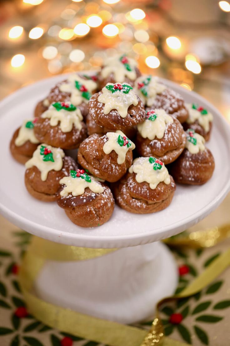 a white plate topped with cookies covered in frosting