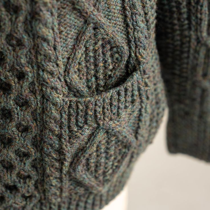 a close up of a sweater on a mannequin