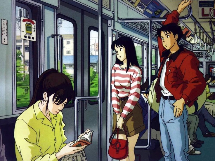 two people standing on a subway car looking at their cell phones while another person stands next to them