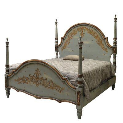 an antique style bed with four posts