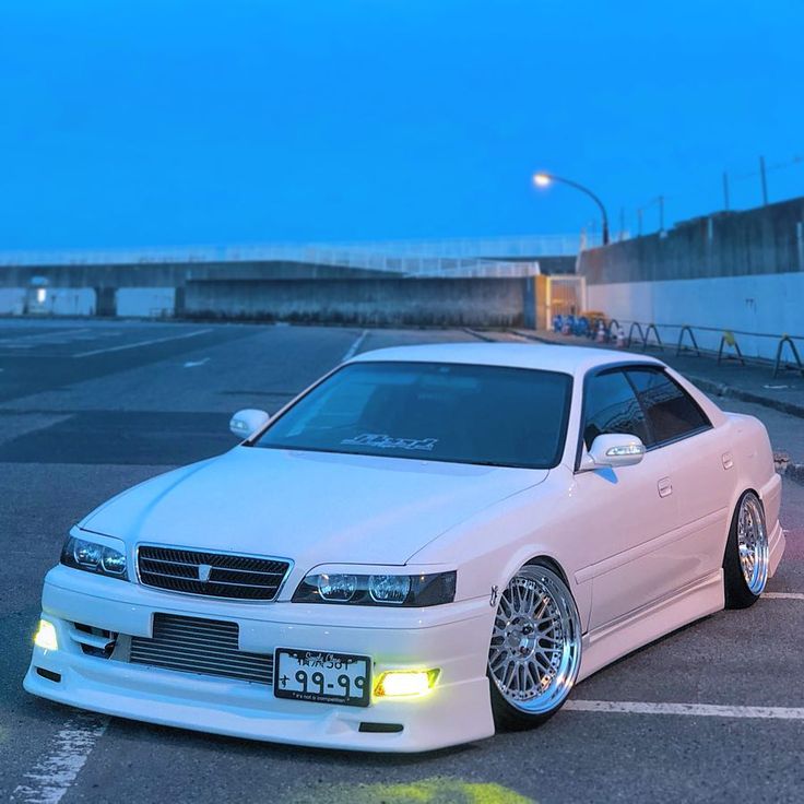 a white car parked in a parking lot