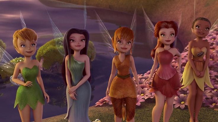 the four fairy girls are standing in front of flowers