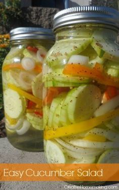 a jar filled with sliced vegetables sitting on top of a sidewalk