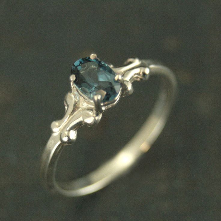 London Blue Topaz Oval Ring 6x4 Baroque Scroll Setting Birthstone Ring Gift for Her Daughter Gift Sweet Sixteen Ring Choose your Stone This is the perfect birthstone ring that she will adore for years! It's classic style, size and shape make it transcend generations. Choose her birthstone and we will expertly set it in place with 4 sturdy prongs. The ring is solid sterling silver. The stone is genuine (unless specified) and measures 6mm by 4mm. The shank of the ring measures 2mm wide by 1mm thic Choose Her, Cute Engagement Rings, Palm Coast, Dream Engagement Rings, Oval Ring, Silver Wedding Rings, Jewelry Lookbook, Ring Oval, Cute Rings