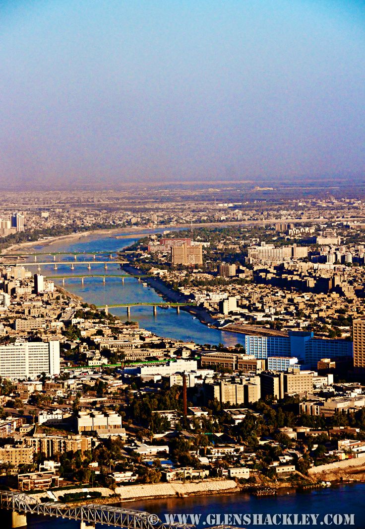 an aerial view of a city and river