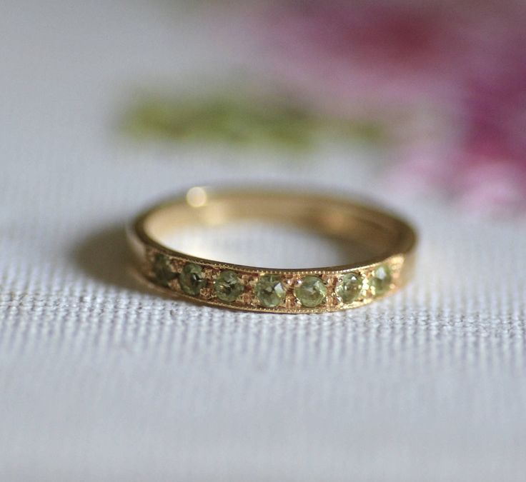 Peridot half eternity ring, Peridot stacking ring, stacking gemstone rings, August birthstone ring, Green Peridot ring, 14k engagement ring Handmade delicate half eternity stacking ring, stoned with 7 beautiful light green gemstones.  This multistone ring is beautiful alone or stacked together with other rings and is colorful and pretty on your finger.  The ring is available in in nickel free, 14 karat gold plating on a brass or sterling silver base.  It is also available in solid sterling silve Interesting Rings Design, Size 10 Rings Women, Green Stone Engagement Ring Gold, Peridot Gold Jewelry, Wedding Ring No Stone, Engagement Signet Ring, Hazel Engagement Ring, Art Deco Peridot Ring, Gold Rings Gemstone