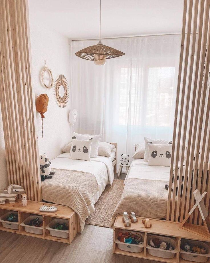 two beds in a room with wooden slats