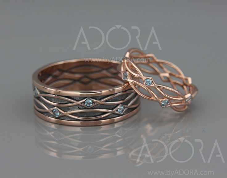 two wedding bands with diamonds on them, one in gold and the other in silver