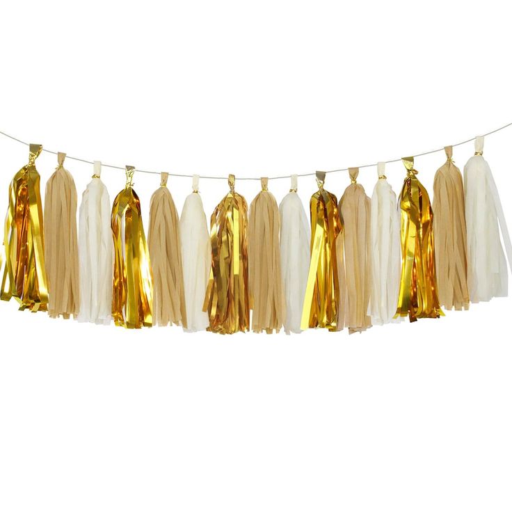 some tassels hanging from a string on a white background with gold foiling