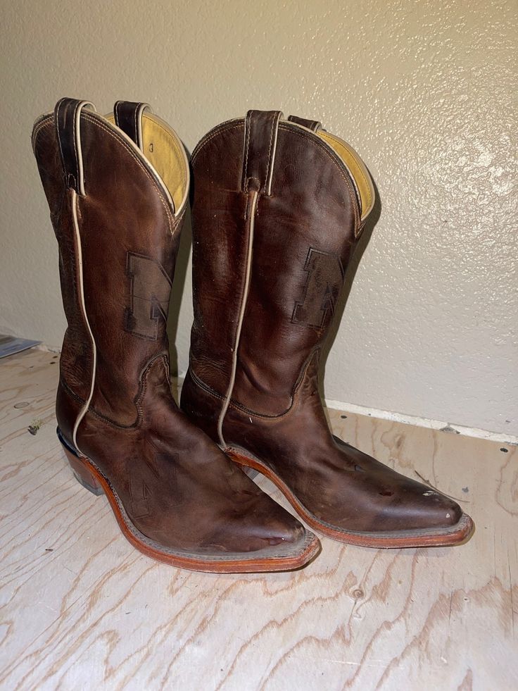 These were purchased as a gift but needed a different width, these boots have Nebraska University logo pressed on both boots: at the shin and top of the boot.  I have a different pair and they are MORE THAN PERFECT. Nebraska University, Coach Backpack Purse, River Island Boots, Nocona Boots, Coach Hobo Bag, Western Brown, Cowboy Western Boots, University Logo, Harness Boots