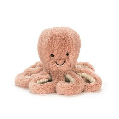 an octopus stuffed animal with a smile on it's face and arms, sitting in front of a white background