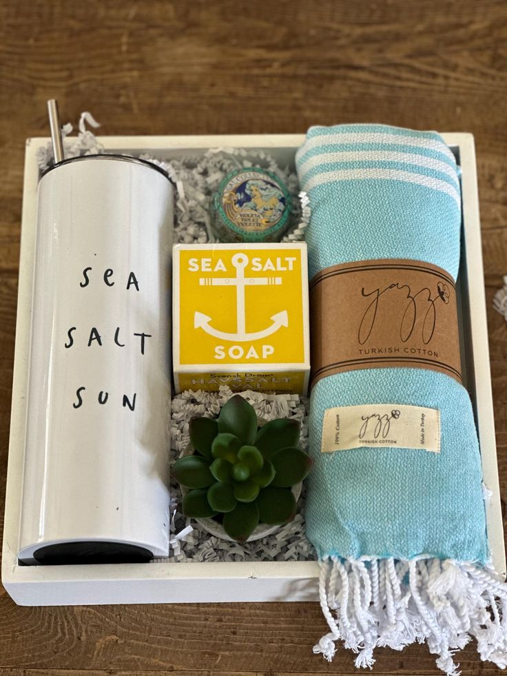 an open box with towels, soap and sea salt