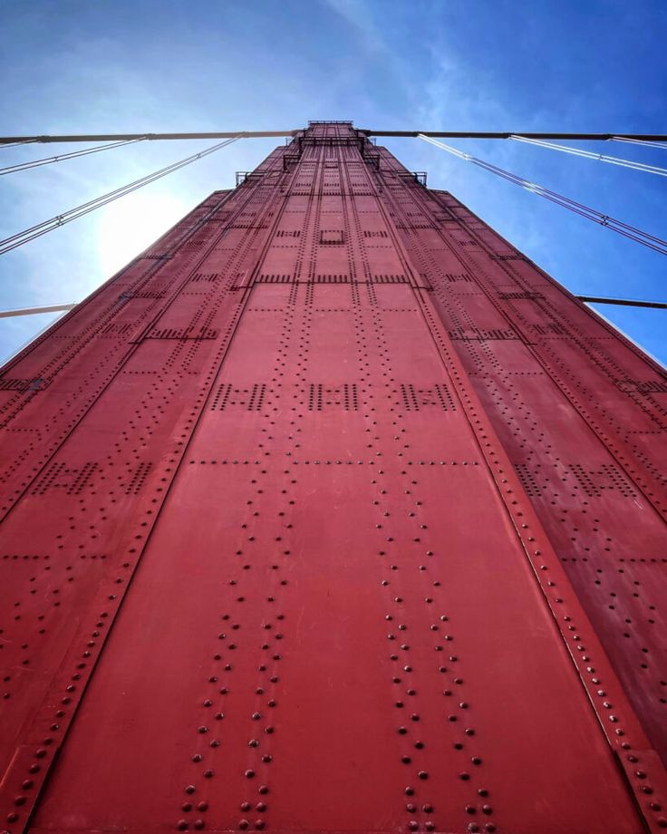 looking up at the top of a tall red building