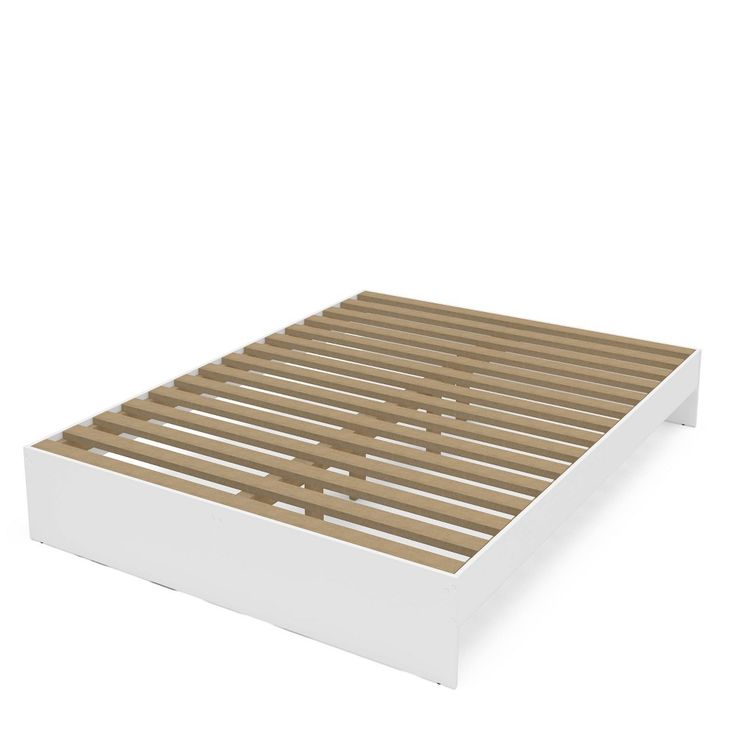 a white bed frame with wooden slats on the top and bottom part, in front of a white background