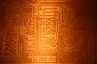 an electronic circuit board is shown in this close up photo, with the light shining on it