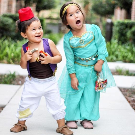 two young children dressed up in costumes on the same page, one is surprised at the other