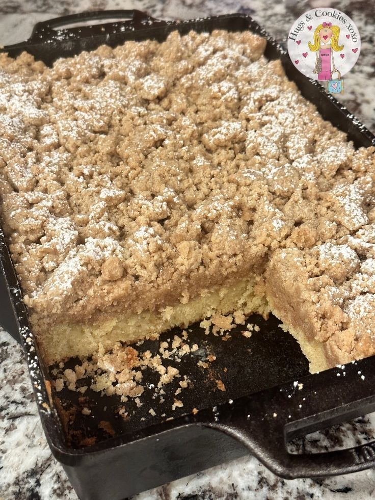 a close up of a cake in a pan on a counter top with a piece missing