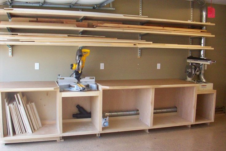 a workbench with some tools on top of it in a room that is being remodeled