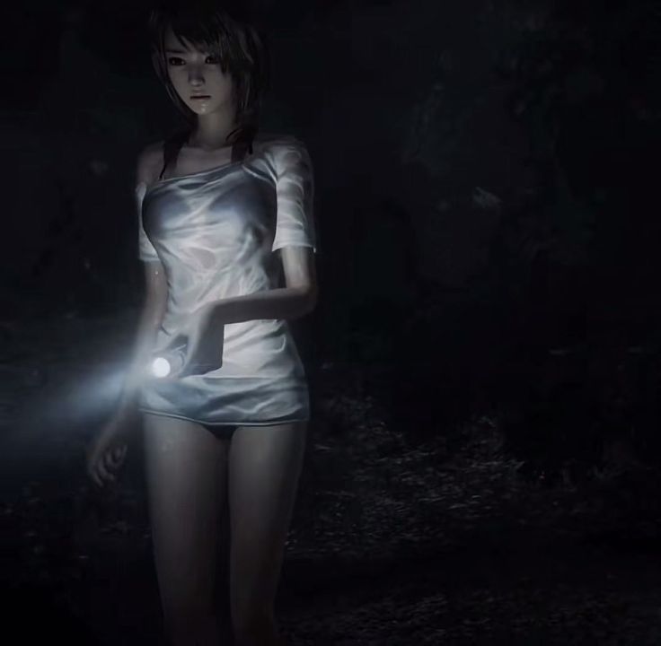 a woman standing in the dark with a flashlight on her hand and wearing a silver dress