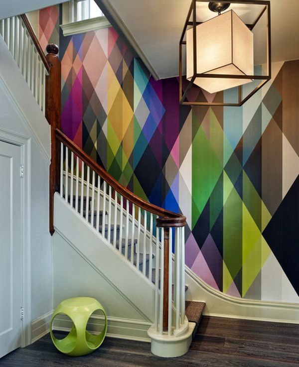 an image of a staircase with colorful wallpaper on the walls and below it is a light fixture