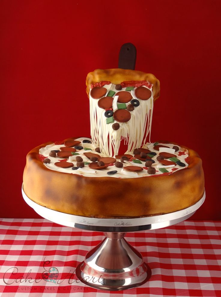 a cake that is sitting on top of a table with a red and white checkered table cloth