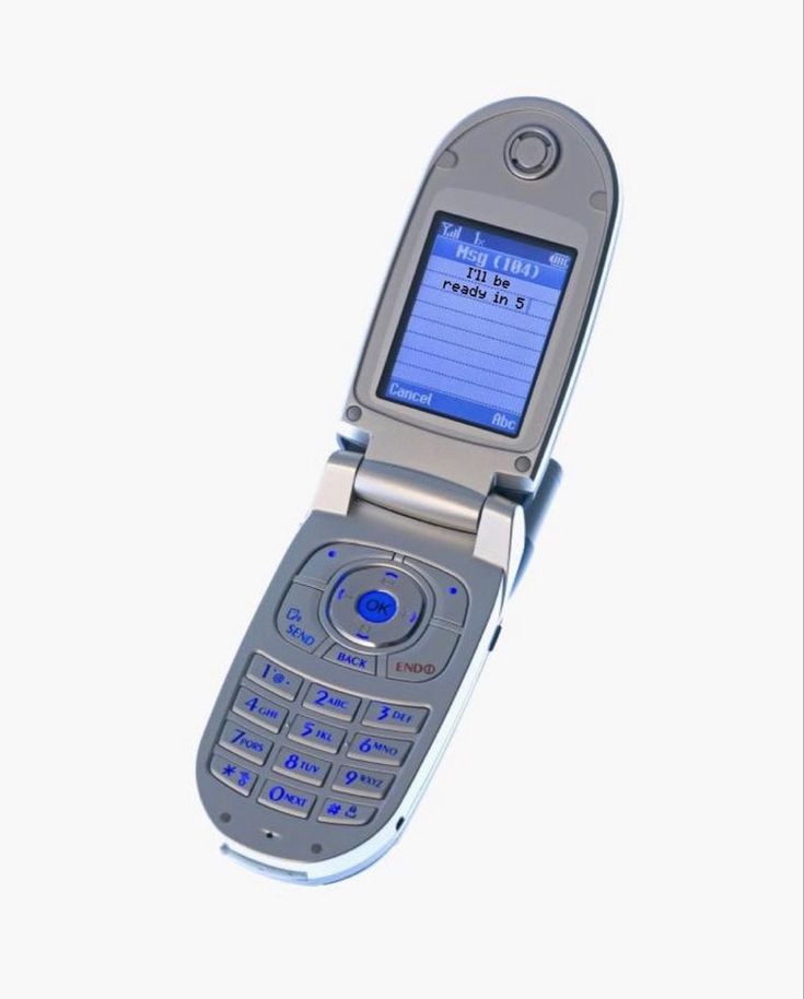 an old cell phone with the time displayed on it's display screen, in front of a white background