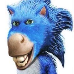 the blue furry animal is smiling with its mouth open and tongue out, as if it's holding something in one hand