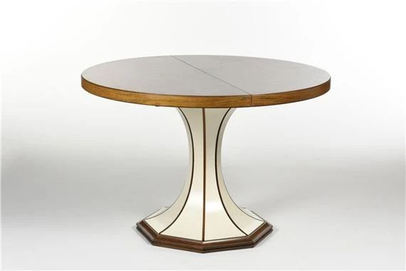 a round dining table with an oval glass top and wooden base, on a white background