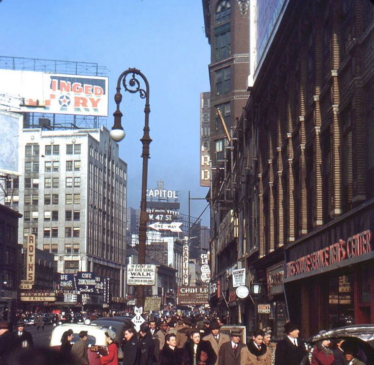 an old photo of people walking down the street in times square, new york city