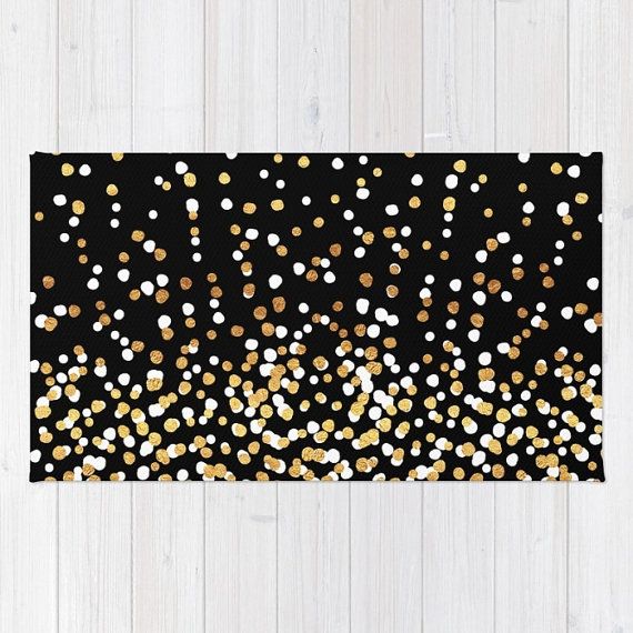 gold and white confetti on black background rug