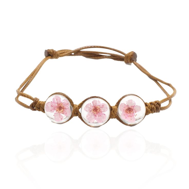 PRICES MAY VARY. 🌸Pendant Diameter:14mm Rope length is adjustable.So it fits most hands.🌸 🌸Material:Real dried flower + Glass +gemstone,Tasteless,Non allergic, Non fade.🌸 🌸This real cherry blossom flower bangle bracelet symbolizes true and eternal love.It is a perfect accessory to your outfit or as an appropriate gift, eg.for your Mother,Wife,Lover,Fiancee,or just a Friend for Mother's Day,Christmas Day, Anniversary Day, Valentines Day and Birthday.🌸 🌸Nature is always amazing, brings us b Birthday Nature, Flower Cherry Blossom, Cherry Blossom Flowers, Cool Gifts For Women, Glass Cover, Bracelet Women, Pink Brand, Flower Bracelet, Pressed Flower