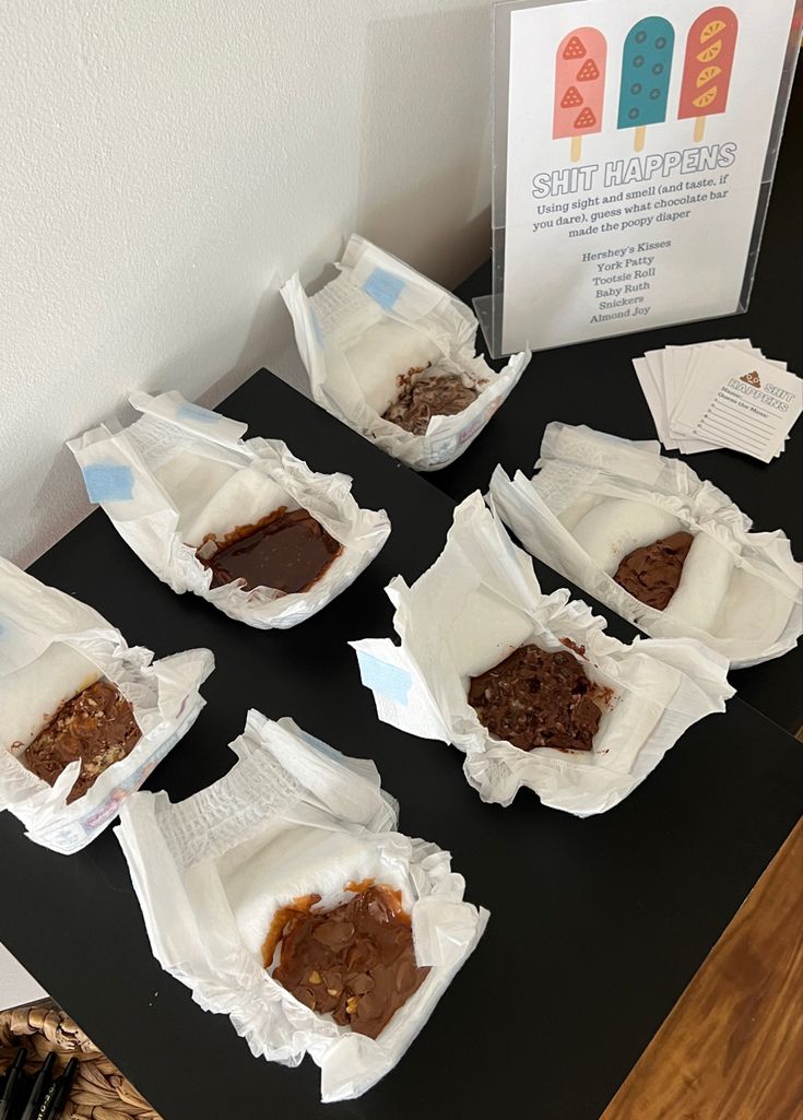 six pieces of cake sitting on top of a table