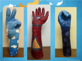 three different types of painted hand puppets on a wooden table with blue sky and clouds in the background