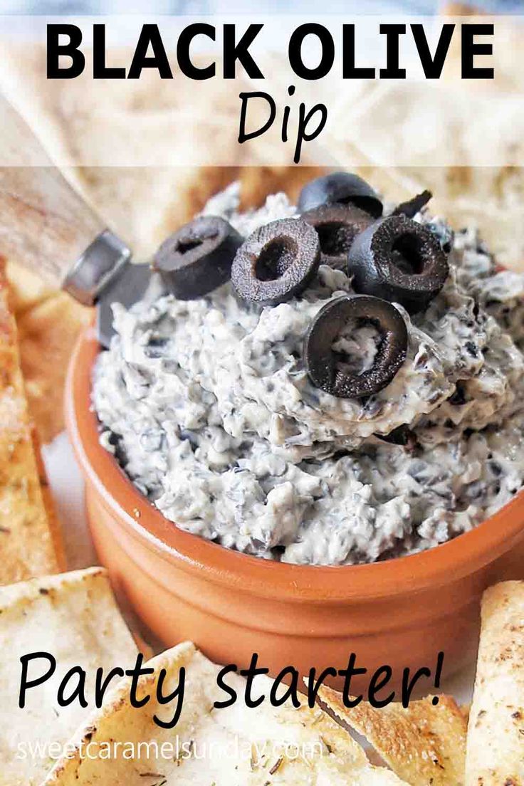 black olive dip party starter with crackers and pita chips