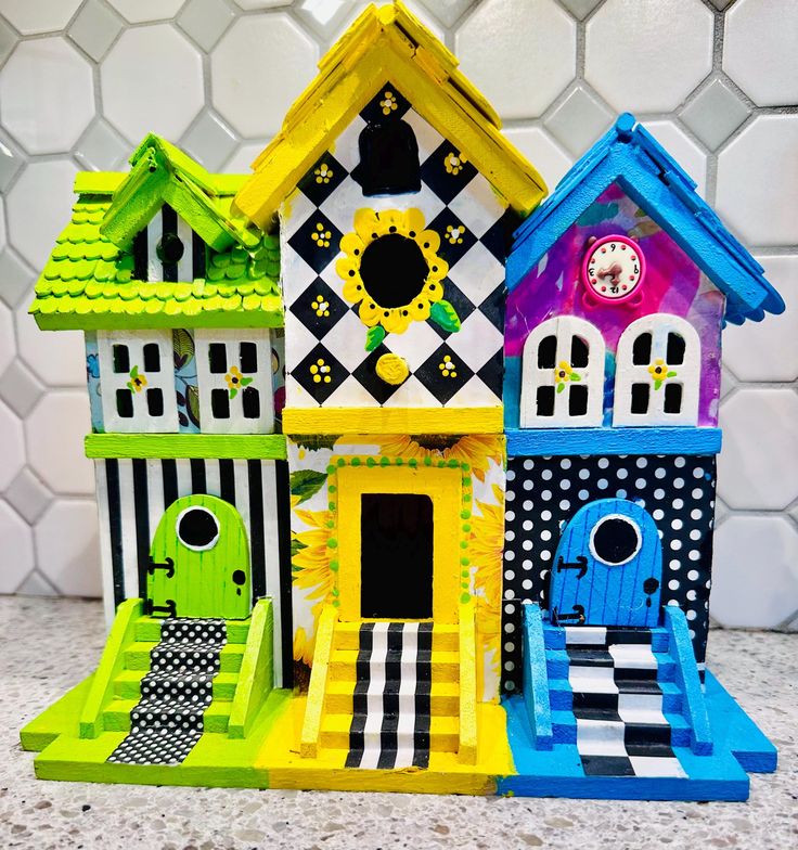 This 3 section birdhouse is fun and colorful which makes it a perfectly unique gift for any occasion. This item does not offer free shipping.   Birdhouse is made from light weight craft wood which is not weatherproof. This birdhouse is only appropriate for use inside a home, covered patio, gazebo, porches etc.  The hand shingled roofs gives it a uniquely different appeal from most birdhouses. It's been embellished with hand painting and decoupage and then sealed with a protective sealant. It's an original one of a kind item. Paint is non-toxic, lead free, water based acrylic paint.  Measurements: 5.5" deep x 9" tall x 9.5" wide Than you for visiting and supporting my momma shop! Hand Painted Birdhouses, Water Based Acrylic Paint, Craft Wood, Patio Gazebo, Columbia Sc, Artisan Design, Hand Painting, Garden Decoration, Covered Patio