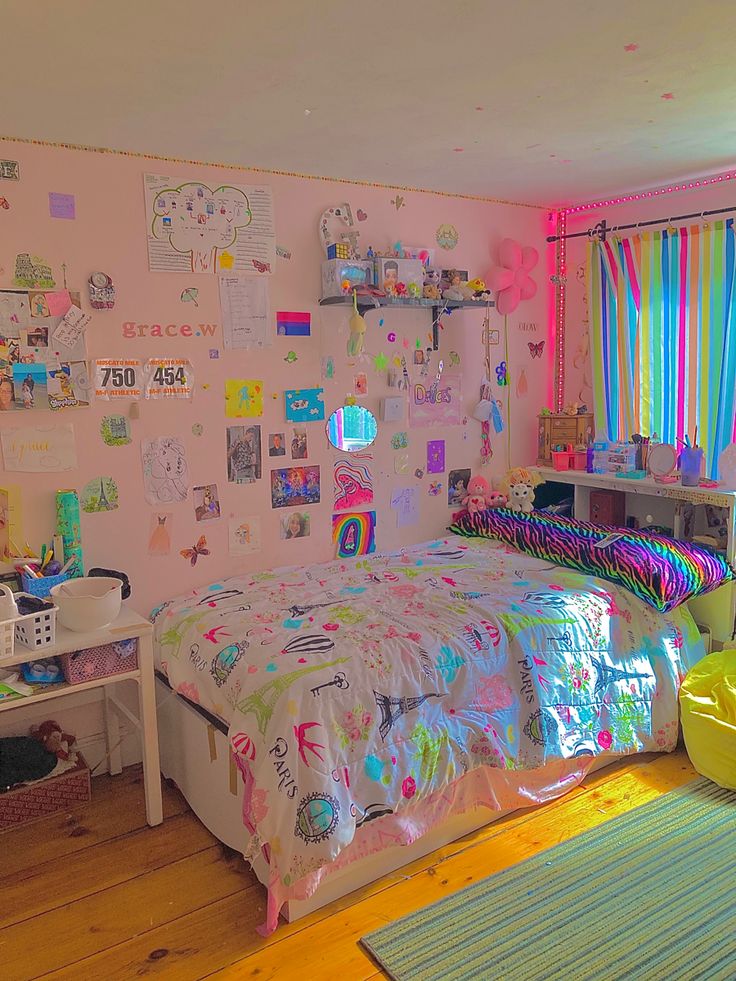 a bedroom decorated in pastel colors with lots of clutter on the walls and floor