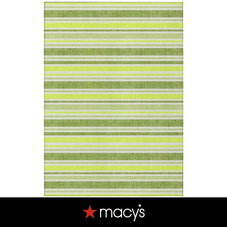 a green and white striped rug with the word macy's written in red on it