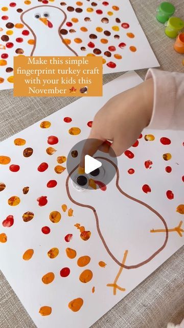 a child is making a turkey craft with orange and red dots on white paper that says make this simple fingerprint turkey craft