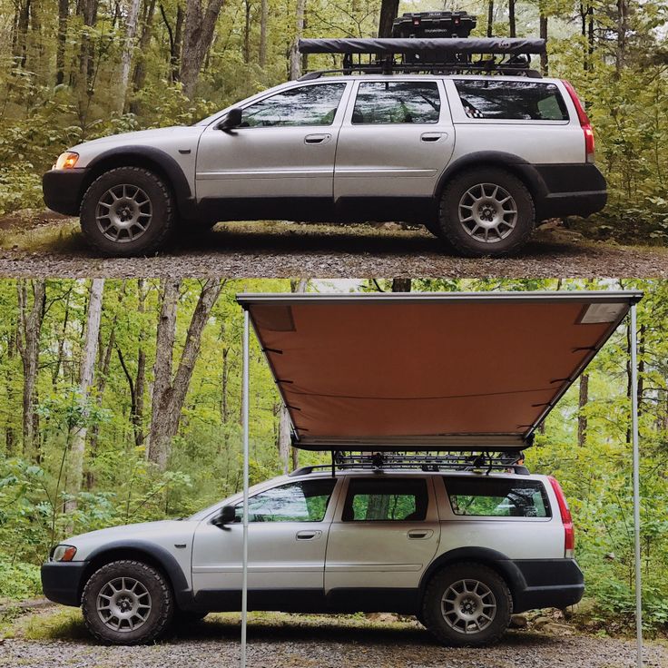 an suv parked in the woods with its roof open