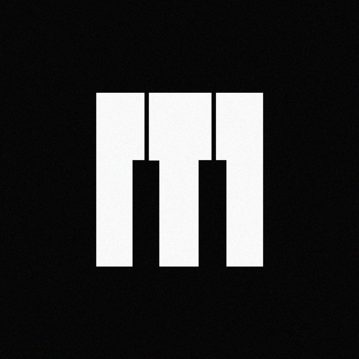 the letter m is made up of three vertical lines in black and white on a dark background