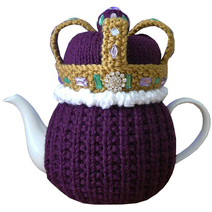 a knitted tea pot with a crown on top